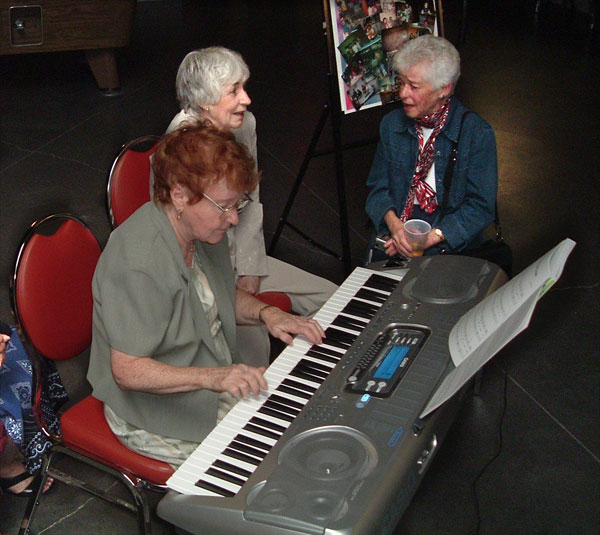 Tessie at the piano with her sisters Celia and Rita